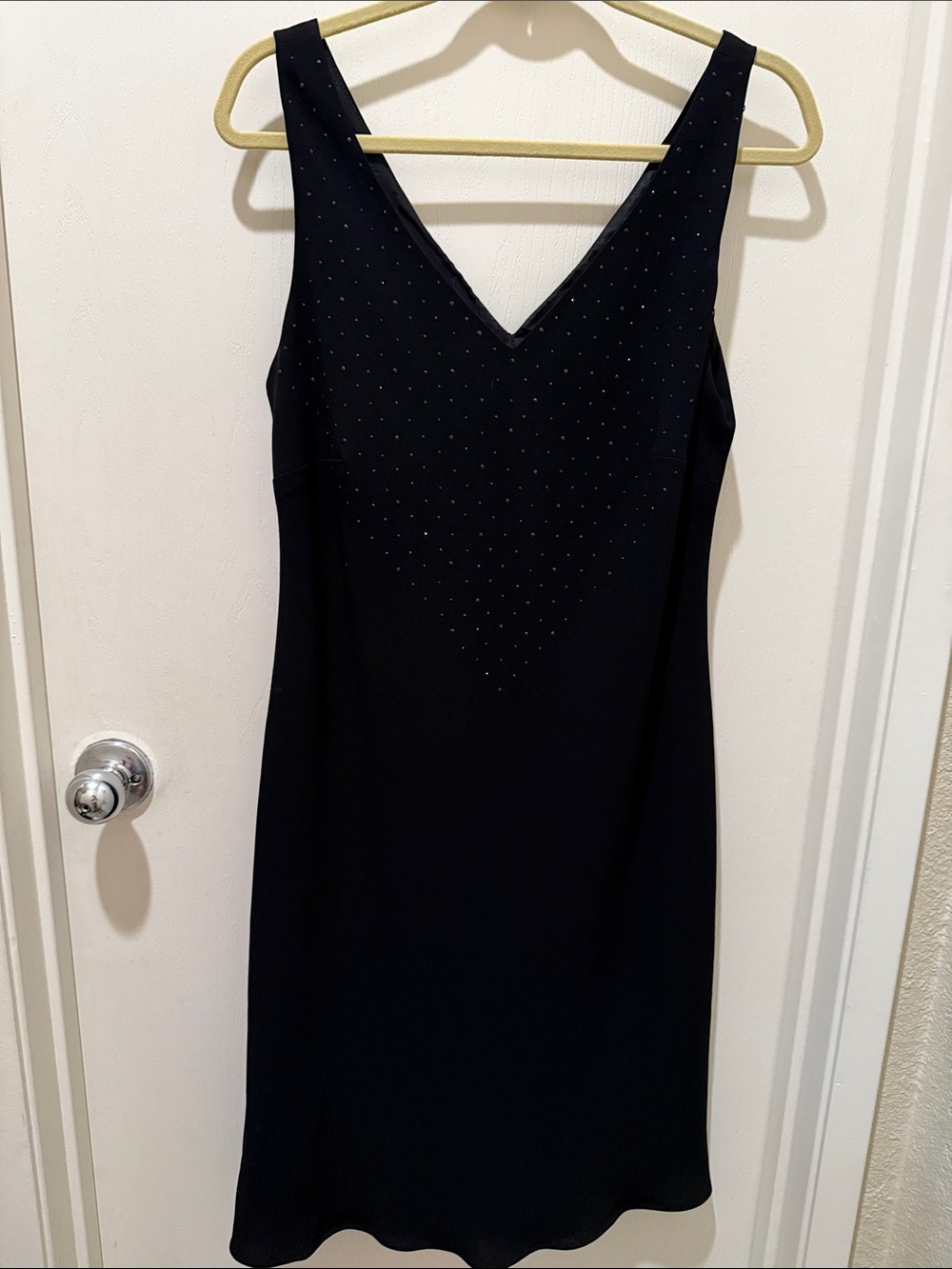 Sleeveless Black V-Neck Dress with Subtle Stud Accents